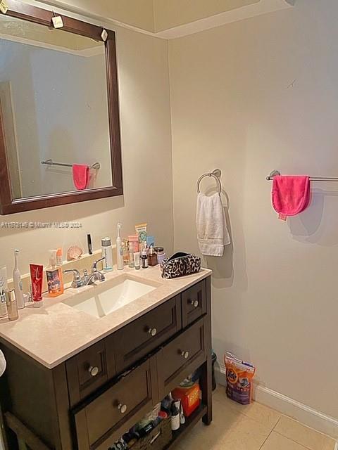 7580 Southwest 82nd Street, Unit F217 Miami, FL 33143 - Photo 8 of 14 a bathroom with a sink vanity and a mirror