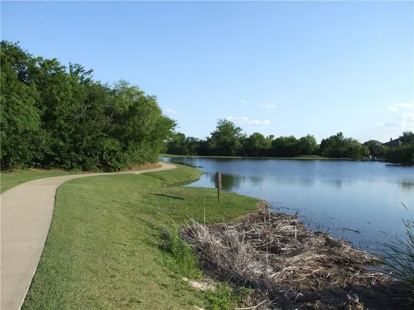 a view of lake with green space