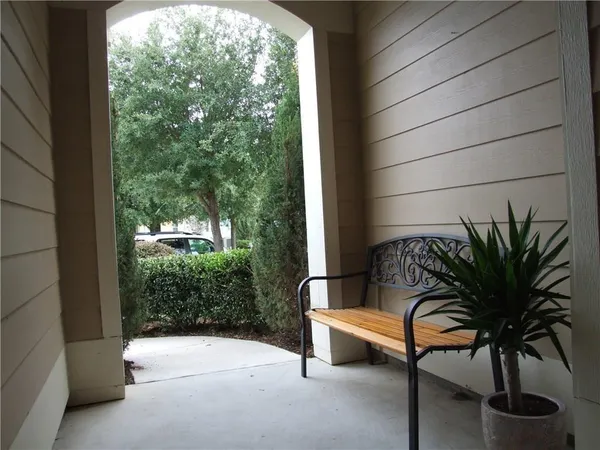 a view of a room with a window and wooden floor