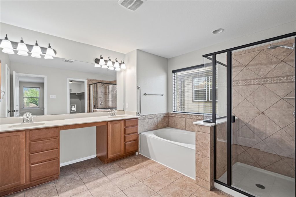8804 Capitol View Drive Austin, TX 78747 - Photo 25 of 32 a large white bathroom with a granite countertop sink mirror and bathtub