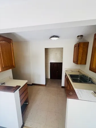 a kitchen that has a sink and a stove