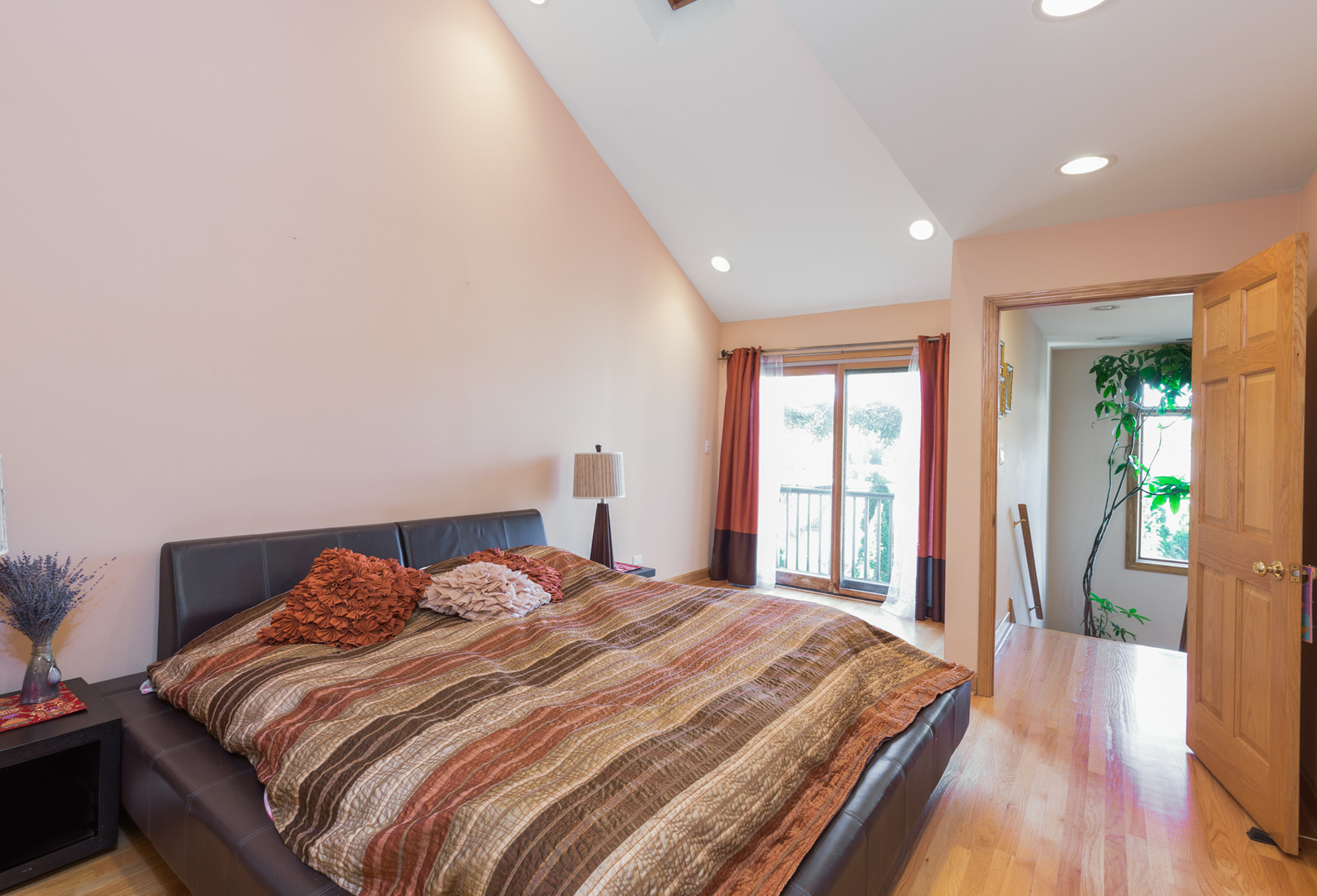 1050 Ridge Road Highland Park, IL 60035 - Photo 17 of 33 a bedroom with a bed and wooden floor