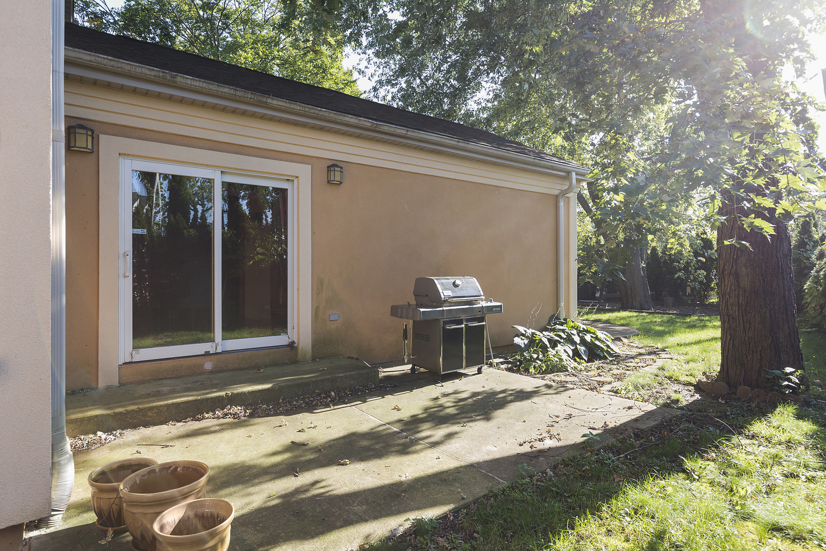 1050 Ridge Road Highland Park, IL 60035 - Photo 29 of 33 a backyard of a house with yard and outdoor seating
