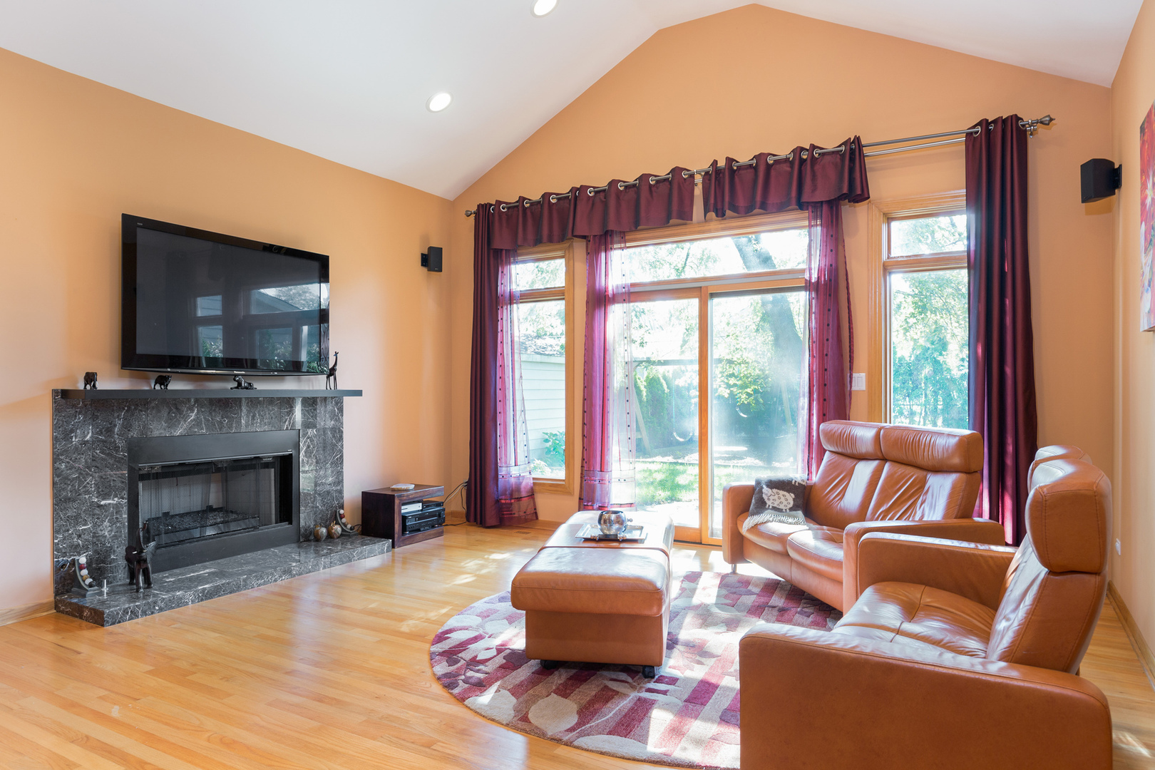 1050 Ridge Road Highland Park, IL 60035 - Photo 10 of 33 a living room with furniture a fireplace and a flat screen tv