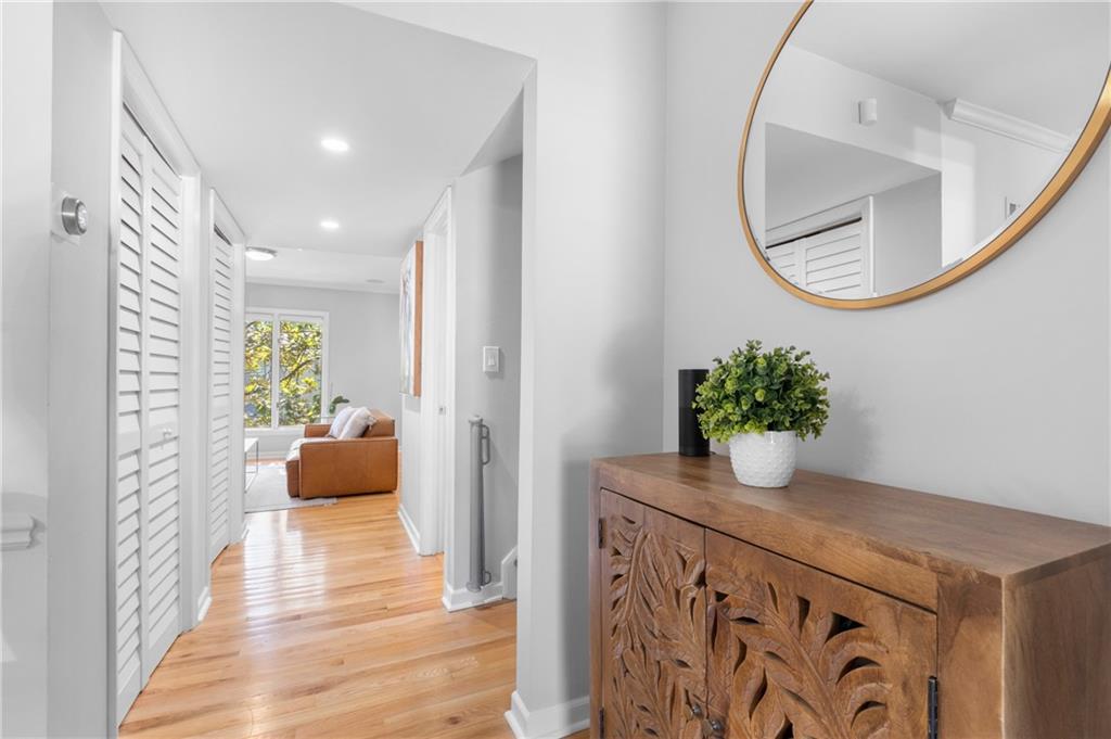 a view of an entryway with wooden floor