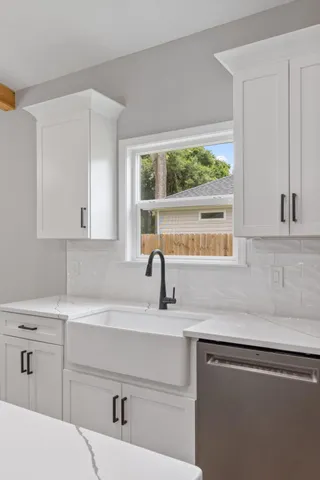 a kitchen with appliances cabinets and a sink