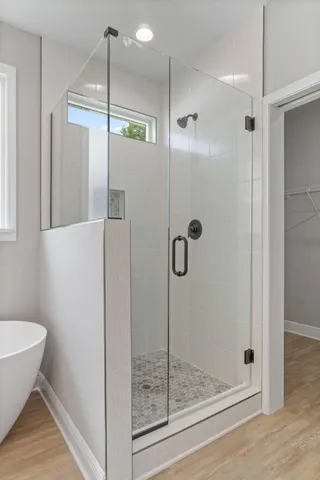 a bathroom with a shower and a mirror
