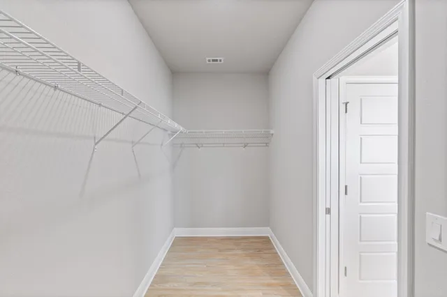 a view of a room with racks on the wall