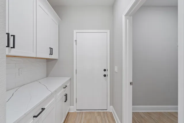 a view of storage and utility room in white wall