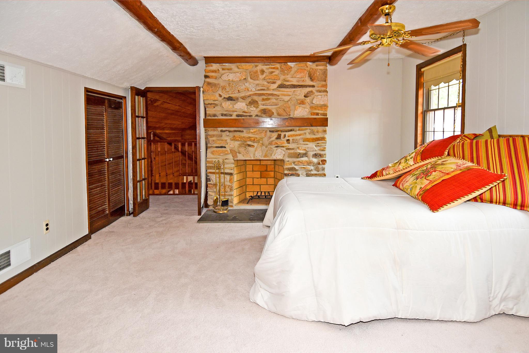 878 Sycamore Hill Road Severn, MD 21144 - Photo 22 of 29 UPPER LEVEL BEDROOM HAS FIREPLACE AND LOFT