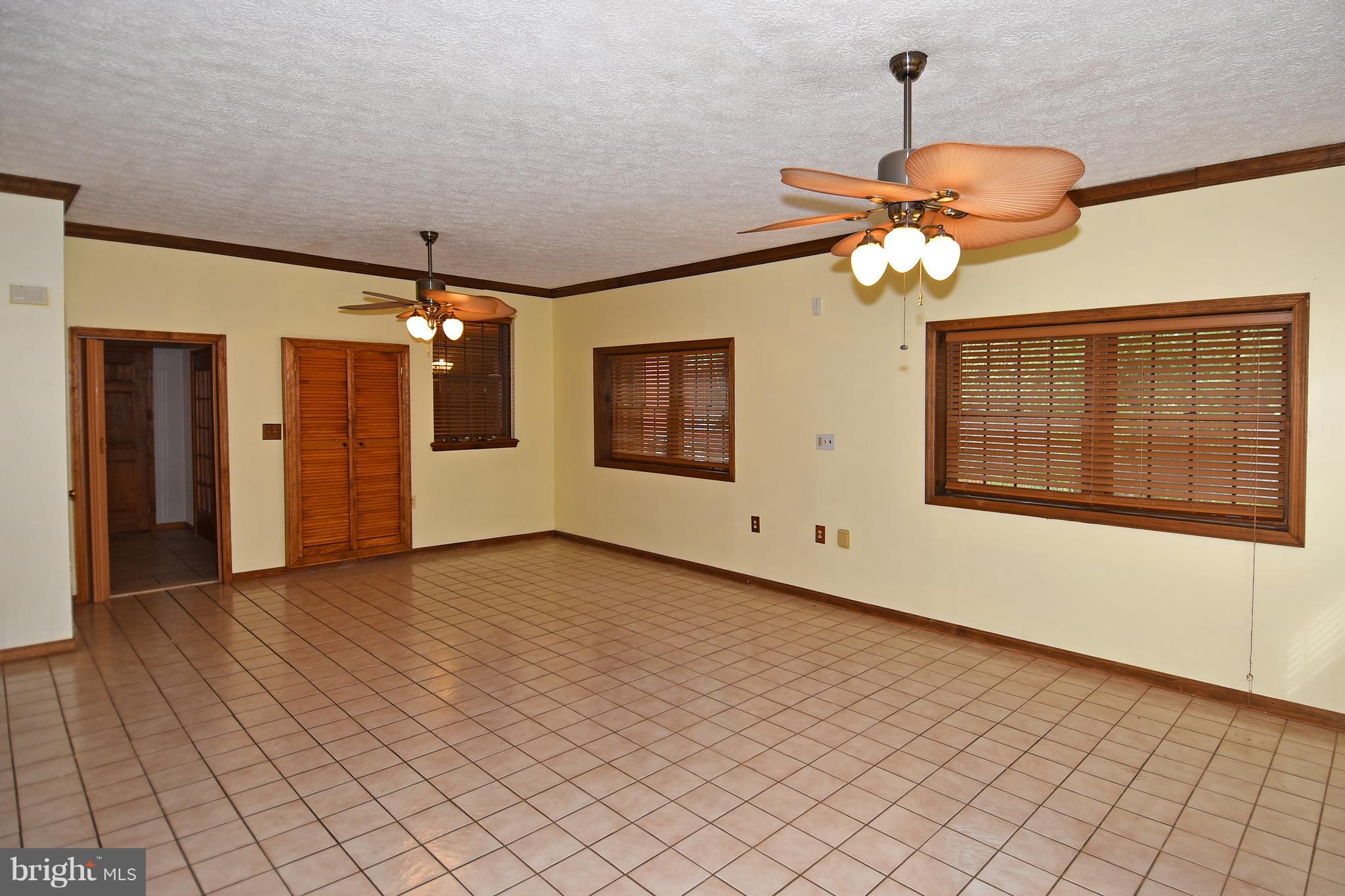 878 Sycamore Hill Road Severn, MD 21144 - Photo 4 of 29 HUGE FAM RM ON MAIN LEVEL HAS LIGHTED CEILING FANS