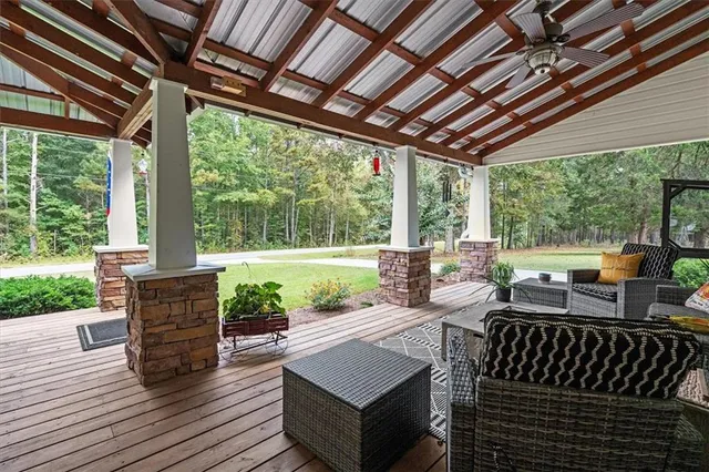 a living room with fireplace furniture and a flat screen tv