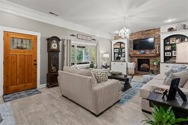 a kitchen with a cabinets and a clock on the wall