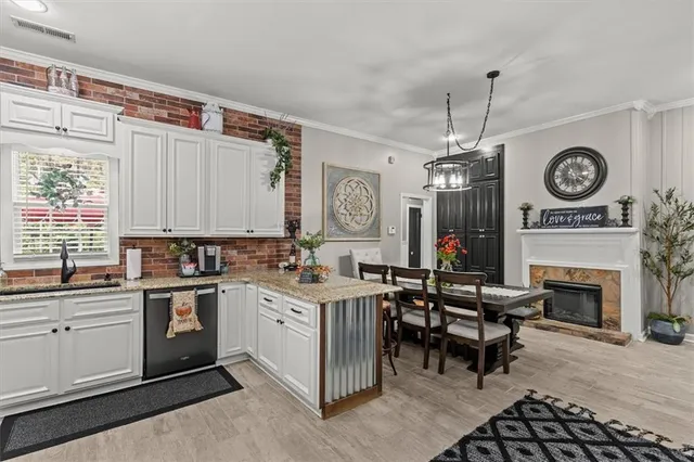 a bathroom with a double vanity sink toilet mirror and shower