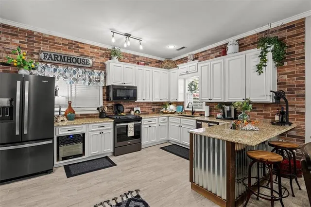a kitchen with furniture and a stove