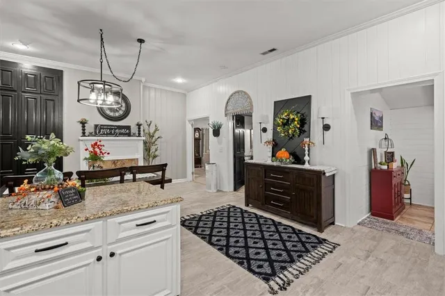 a bedroom with a bed dresser and a window