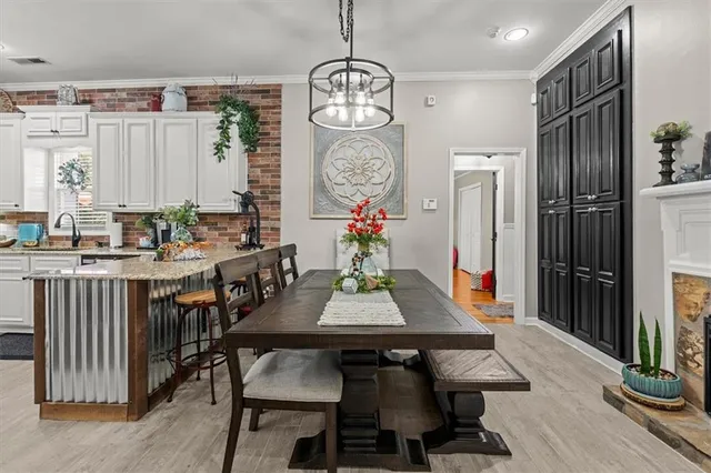 a bathroom with a sink vanity mirror and tub
