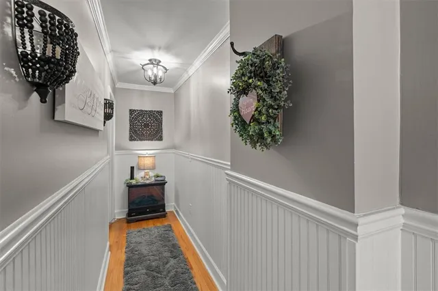 a living room with furniture a window and a flat screen tv