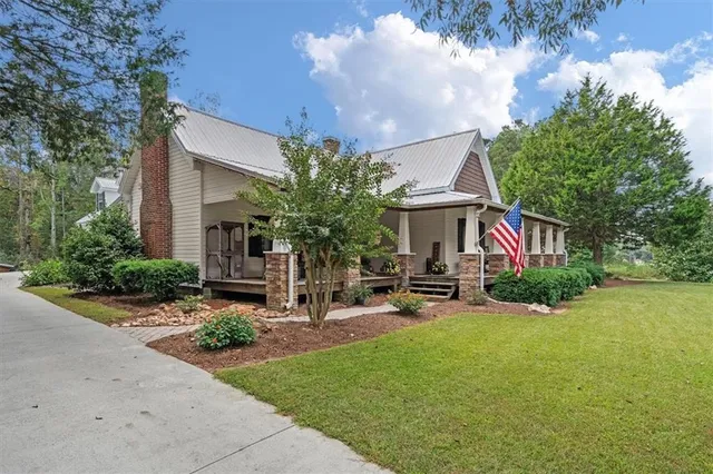 a front view of a house with garden