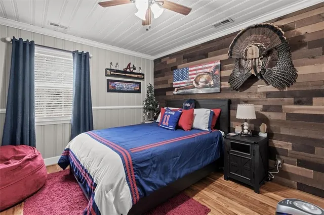 a room with furniture or chandelier and a wooden floor