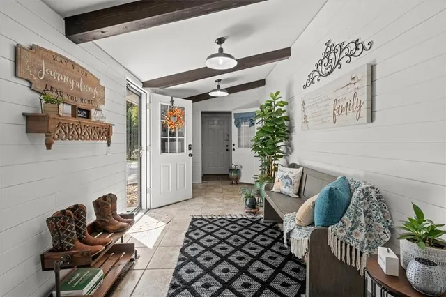 a front view of a house with swimming pool and porch