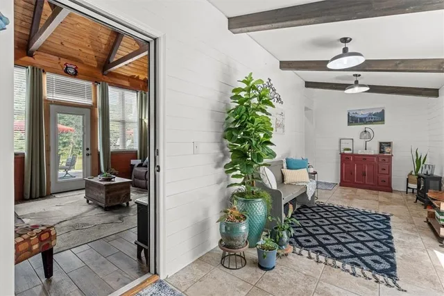 a view of a house with sitting area and a yard