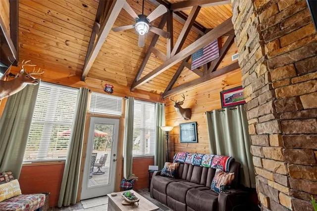 a view of a patio with table and chairs potted plants