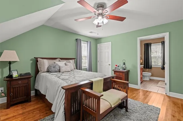 a view of a small house in the middle of a yard