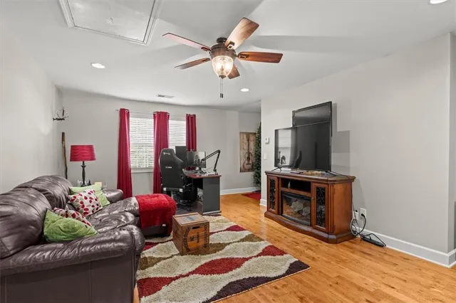 an aerial view of a house with swimming pool and garden