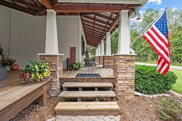 a view of an entryway with wooden floor