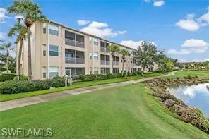 a view of building with river in front of it