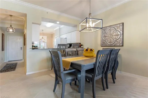 a dining room with furniture and window