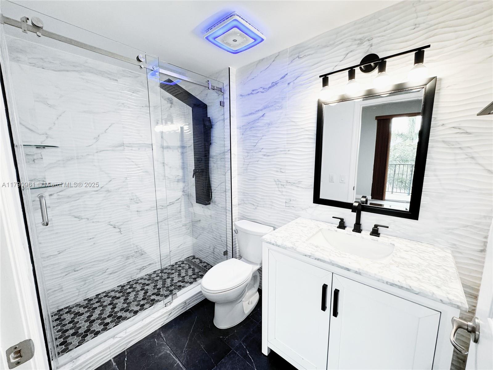 8440 Southwest 8th Street, Unit 304A Miami, FL 33144 - Photo 14 of 21 a bathroom with a sink toilet and shower