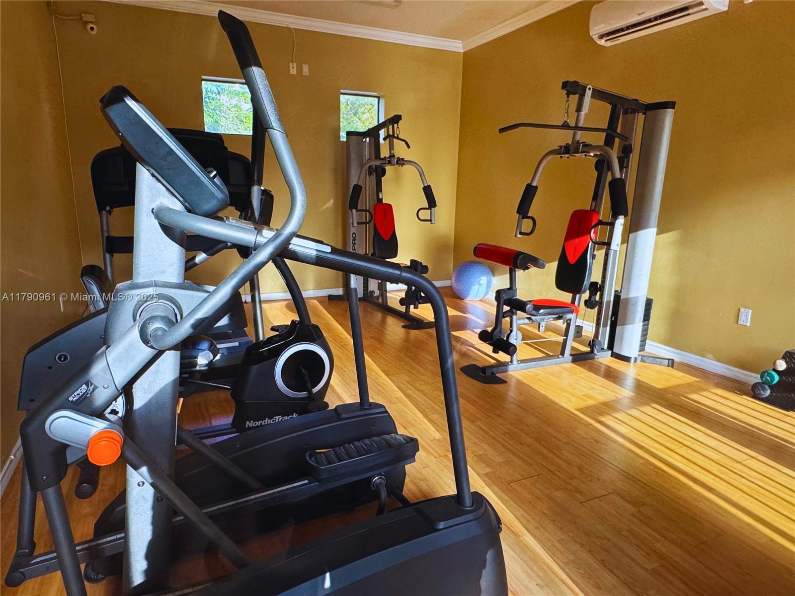 8440 Southwest 8th Street, Unit 304A Miami, FL 33144 - Photo 20 of 21 a view of an entryway with wooden floor