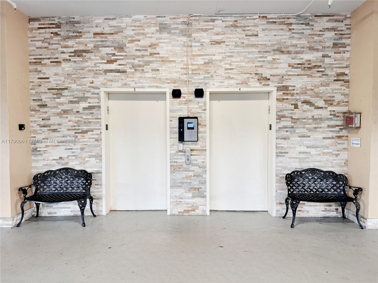 8440 Southwest 8th Street, Unit 304A Miami, FL 33144 - Photo 2 of 21 a living room with furniture and a fireplace