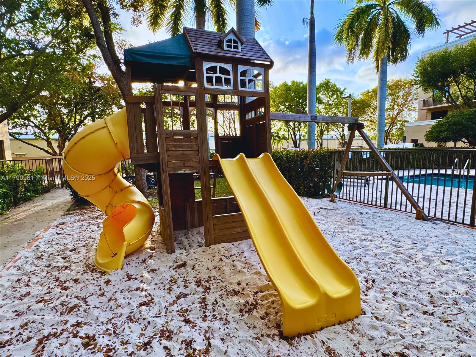 8440 Southwest 8th Street, Unit 304A Miami, FL 33144 - Photo 21 of 21 a view of a swimming pool with a lounge chair