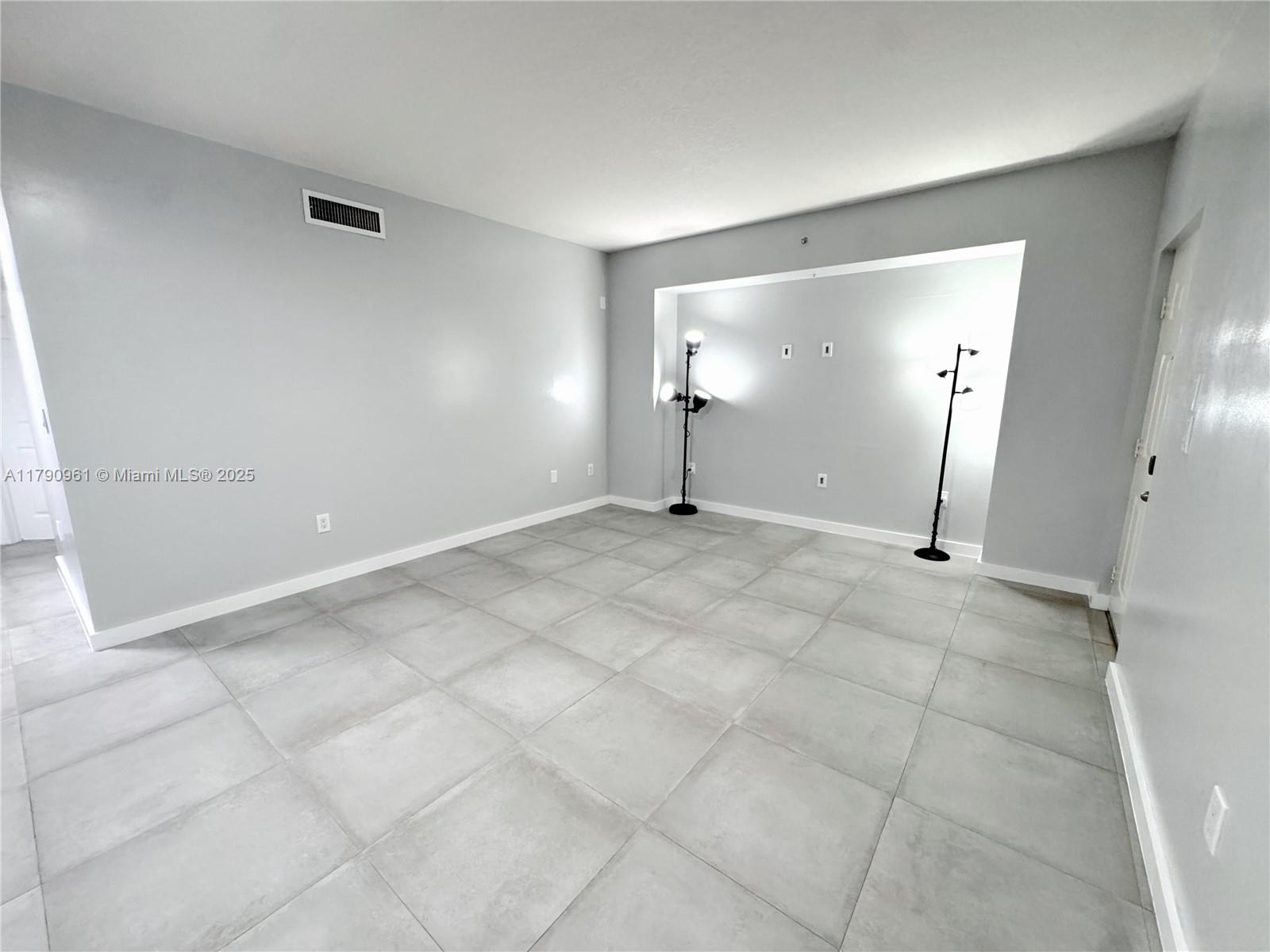 8440 Southwest 8th Street, Unit 304A Miami, FL 33144 - Photo 5 of 21 a view of a room with an empty space