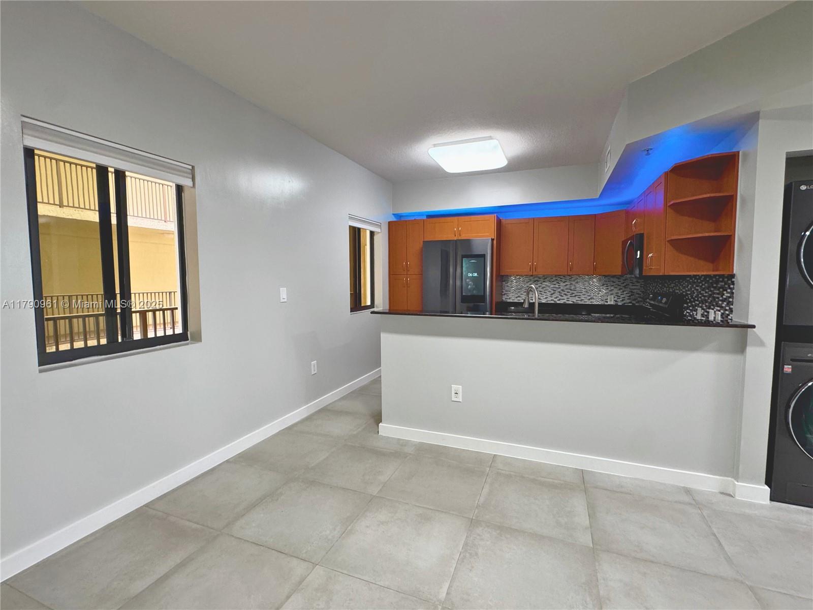 8440 Southwest 8th Street, Unit 304A Miami, FL 33144 - Photo 7 of 21 a view of a room with a large window