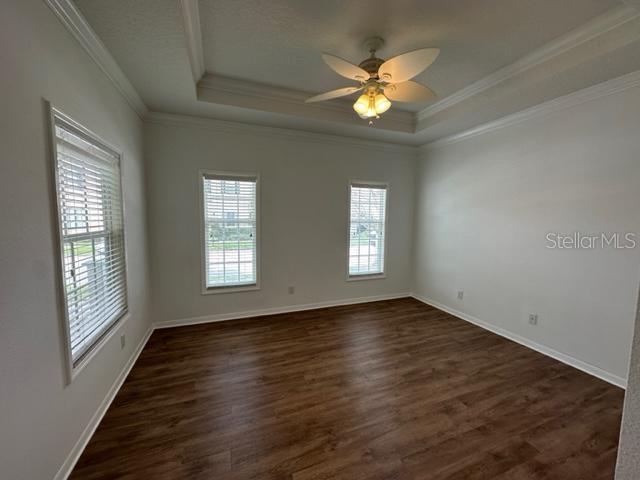 1005 Wiregrass Street Celebration, FL 34747 - Photo 14 of 31 a view of an empty room with wooden floor and a window