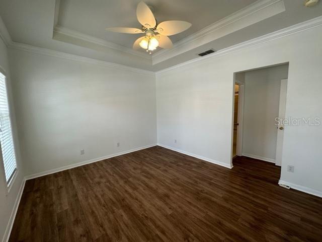 1005 Wiregrass Street Celebration, FL 34747 - Photo 16 of 31 an empty room with wooden floor and a ceiling fan