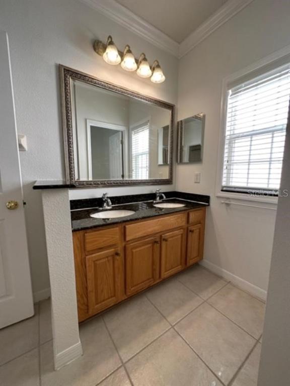 1005 Wiregrass Street Celebration, FL 34747 - Photo 17 of 31 a kitchen with a sink and cabinets