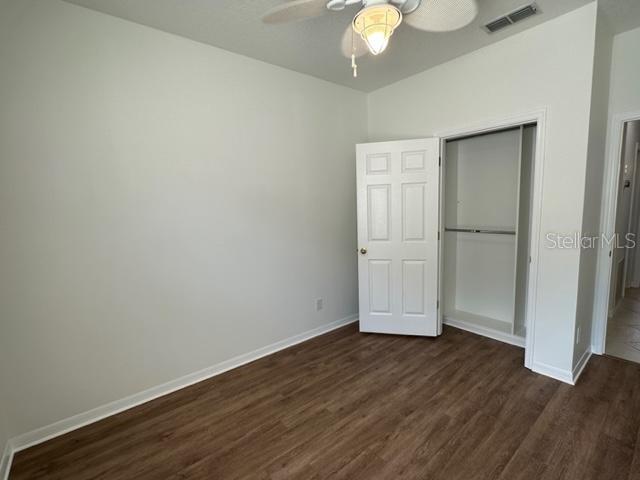 1005 Wiregrass Street Celebration, FL 34747 - Photo 21 of 31 an empty room with wooden floor