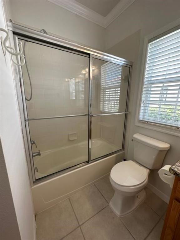 1005 Wiregrass Street Celebration, FL 34747 - Photo 22 of 31 a bathroom with a toilet and a shower