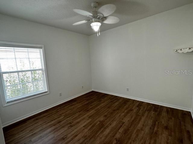 1005 Wiregrass Street Celebration, FL 34747 - Photo 25 of 31 wooden floor in an empty room with a window