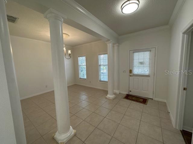 1005 Wiregrass Street Celebration, FL 34747 - Photo 5 of 31 a view of a hallway with wooden floor and a bathroom