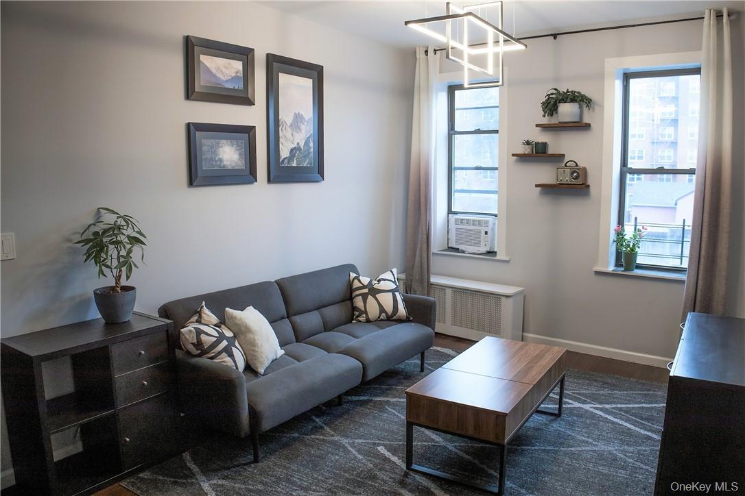 663 Locust Street, Unit 3G Mount Vernon, NY 10552 - Photo 2 of 13 a living room with furniture and wooden floor