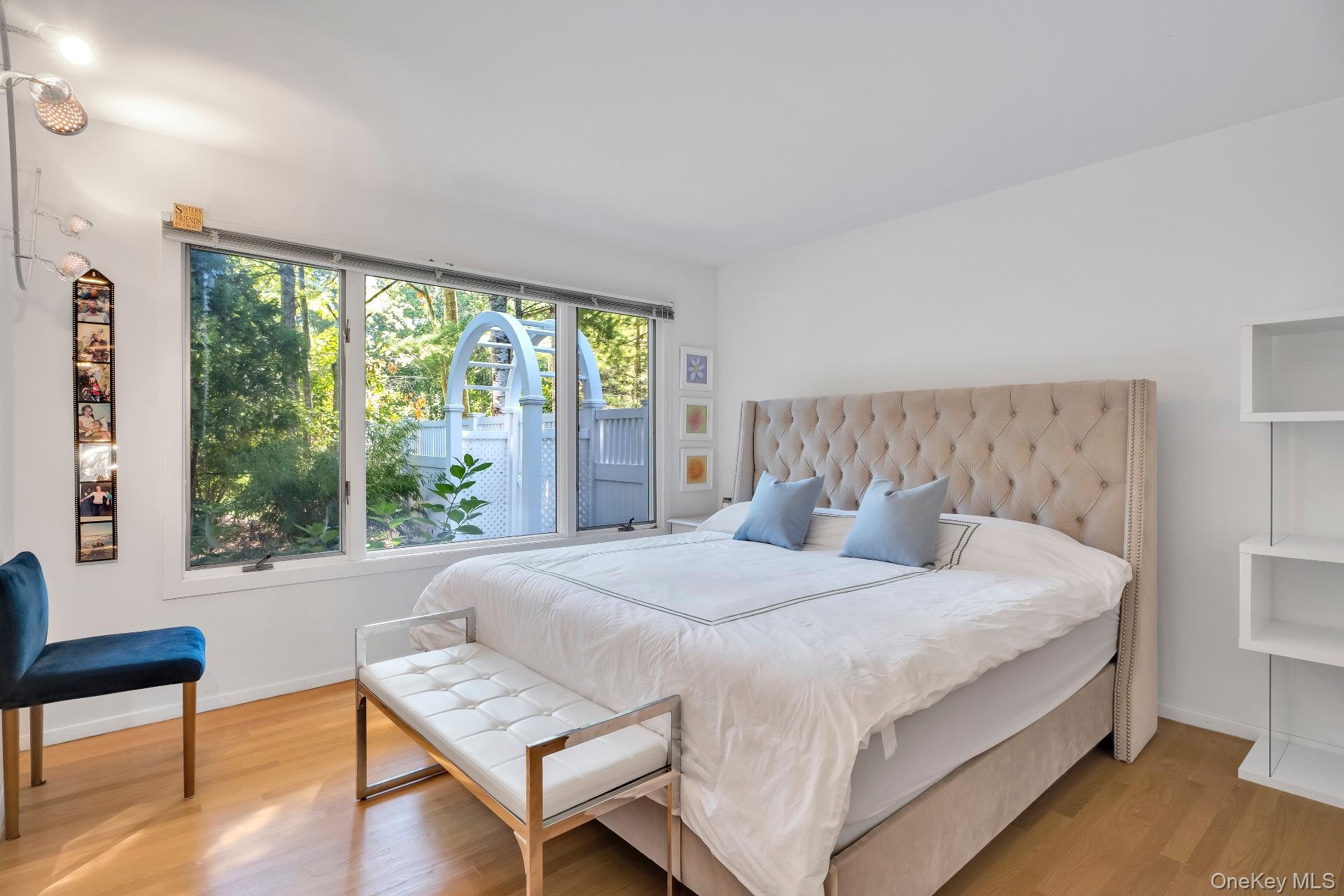 30 Pheasant Run Quogue, NY 11959 - Photo 17 of 26 a bedroom with a bed and a window with outer view