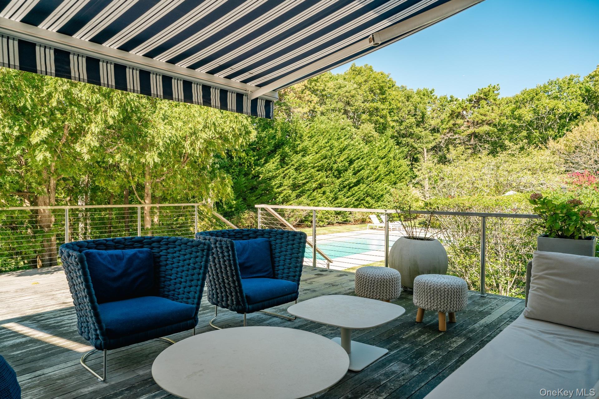 30 Pheasant Run Quogue, NY 11959 - Photo 21 of 26 a balcony with table and chairs