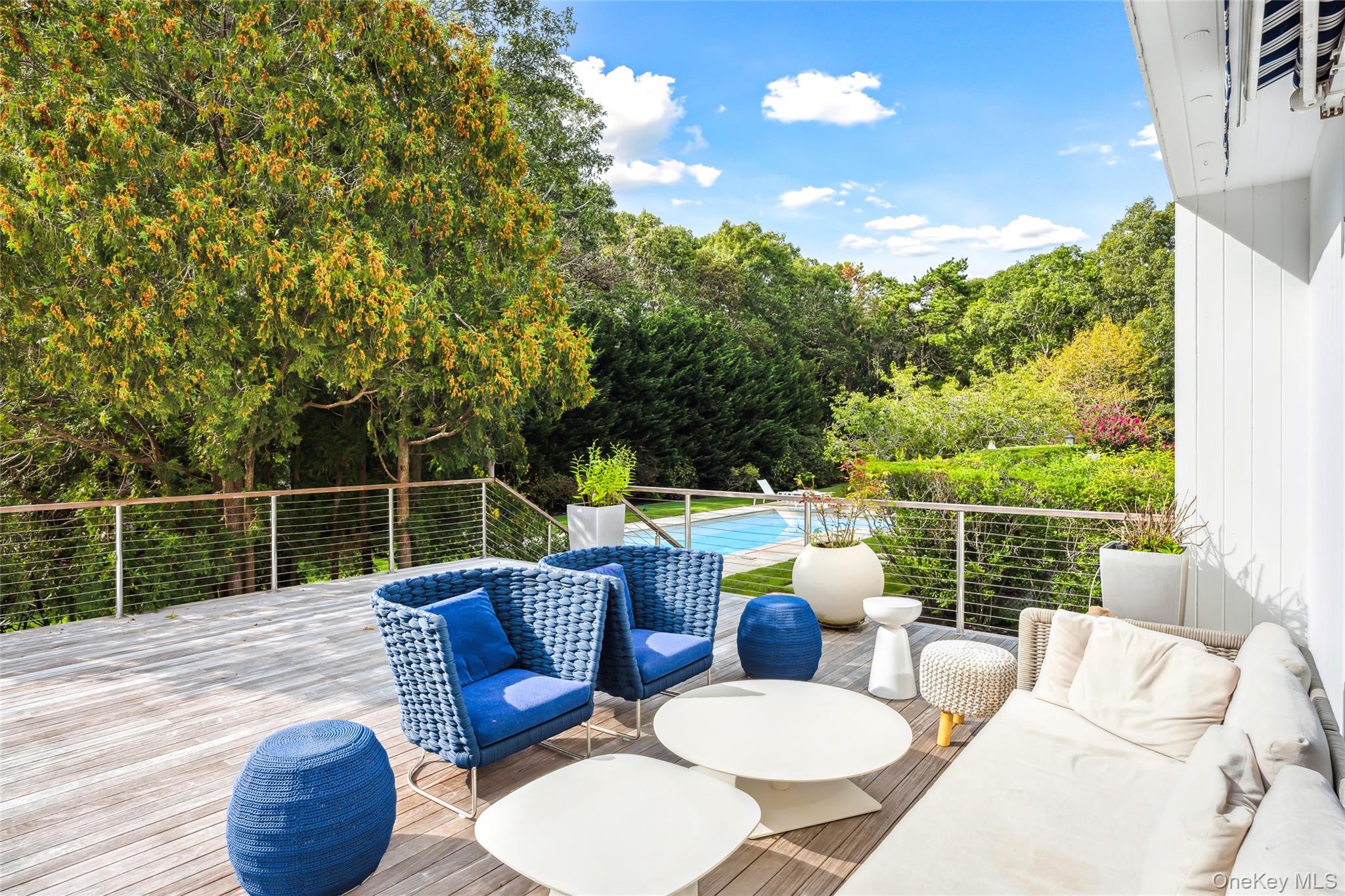 30 Pheasant Run Quogue, NY 11959 - Photo 22 of 26 a view of a chairs and table in the roof deck