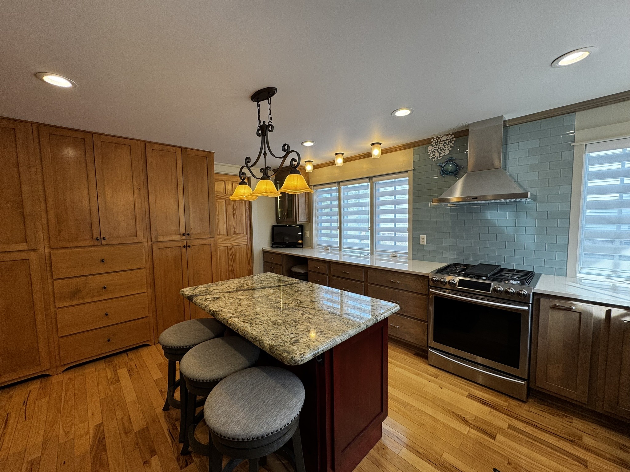 105 Wilson Street Cowan, TN 37318 - Photo 15 of 57 a kitchen with stainless steel appliances granite countertop a stove a sink and a refrigerator